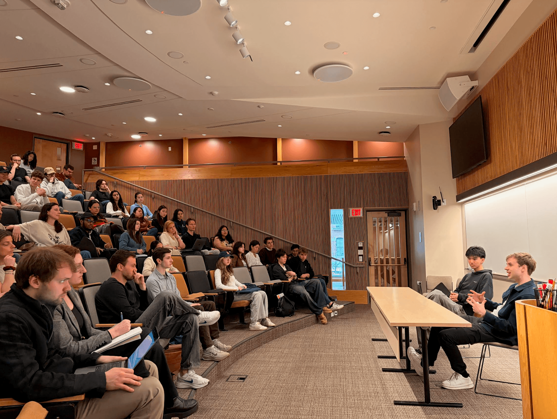 Anton Osika, CEO of Lovable, speaking with researchers at a Research Corner event